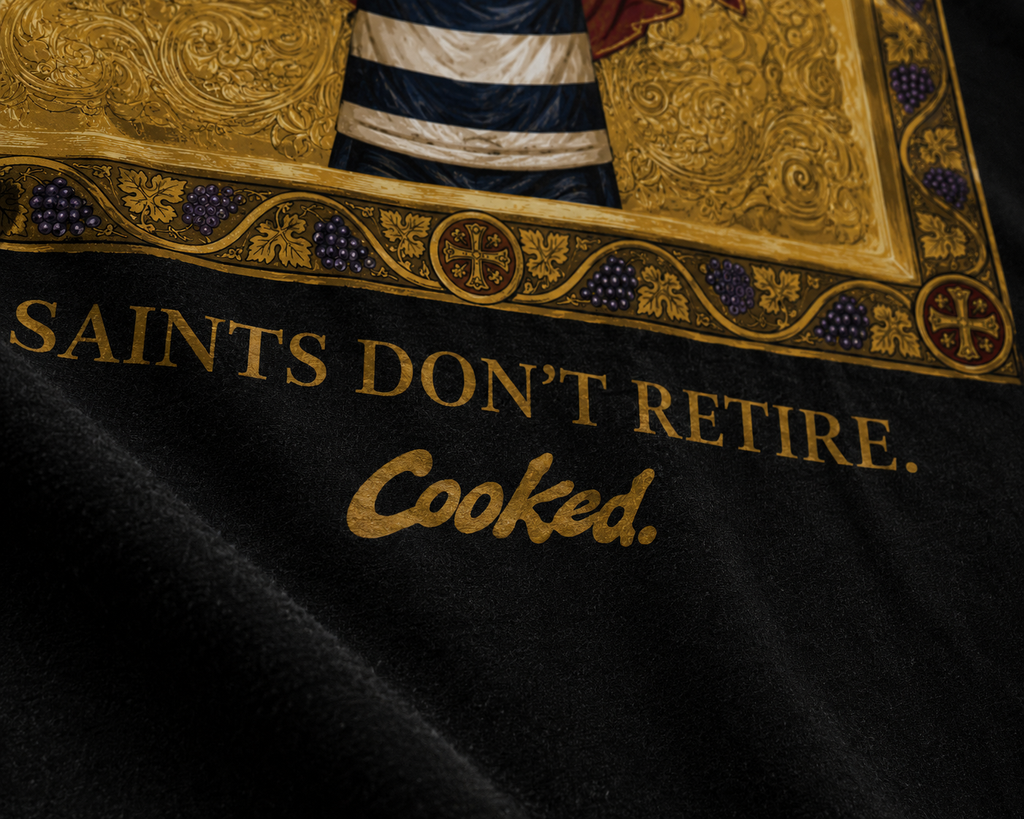 LIVES FOREVER — Cooked 001 on black tee, worn back view, kitchen setting.